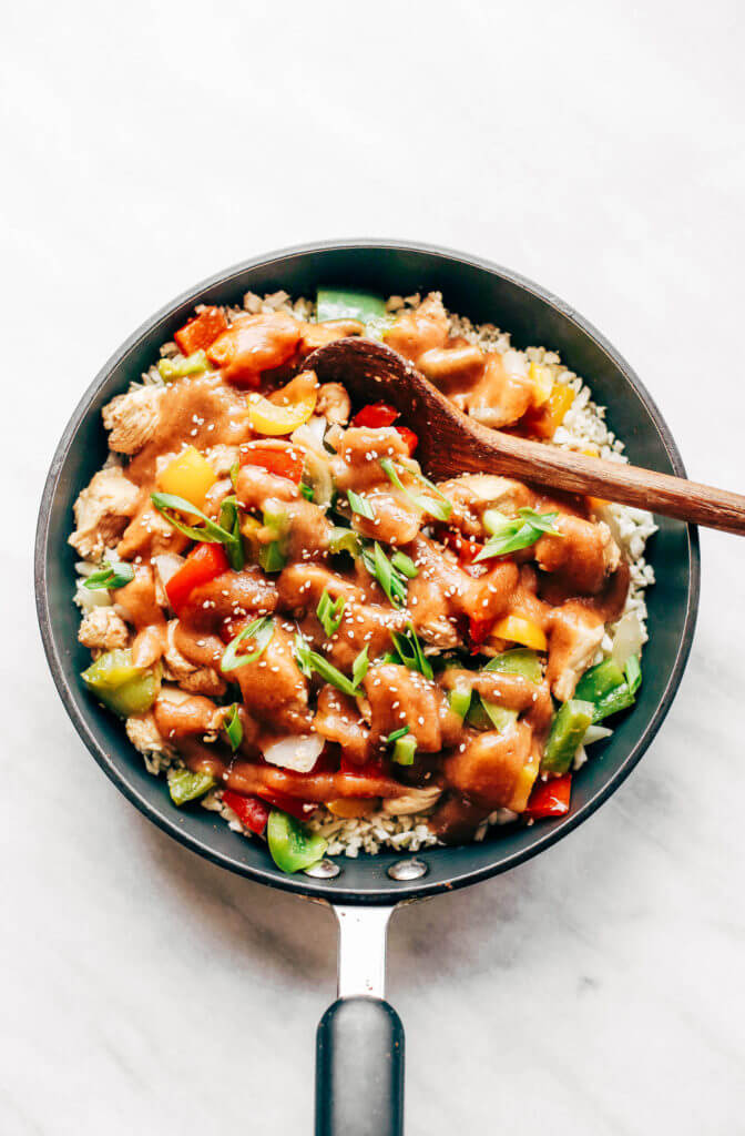 Healthy sweet and sour chicken with cauliflower rice. Paleo, whole30, and made without sugar! An easy weeknight dinner recipe, freezer friendly, and makes for fast meal prep! Whole30 meal plan that's quick and healthy! Whole30 recipes just for you. Whole30 meal planning. Whole30 meal prep. Healthy paleo meals. Healthy Whole30 recipes. Easy Whole30 recipes. Best paleo dinner recipes.