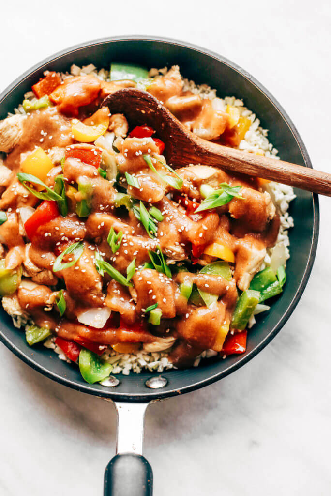 Healthy sweet and sour chicken with cauliflower rice. Paleo, whole30, and made without sugar! An easy weeknight dinner recipe, freezer friendly, and makes for fast meal prep! Whole30 meal plan that's quick and healthy! Whole30 recipes just for you. Whole30 meal planning. Whole30 meal prep. Healthy paleo meals. Healthy Whole30 recipes. Easy Whole30 recipes. Best paleo dinner recipes.