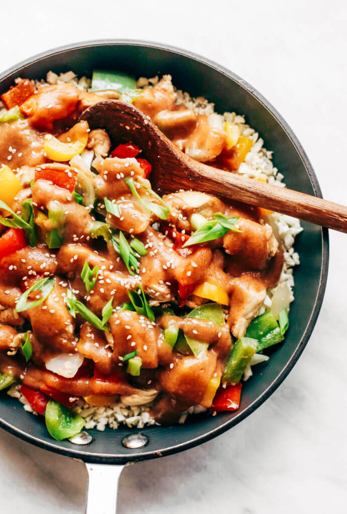 Healthy sweet and sour chicken with cauliflower rice. Paleo, whole30, and made without sugar! An easy weeknight dinner recipe, freezer friendly, and makes for fast meal prep! Whole30 meal plan that's quick and healthy! Whole30 recipes just for you. Whole30 meal planning. Whole30 meal prep. Healthy paleo meals. Healthy Whole30 recipes. Easy Whole30 recipes. Best paleo dinner recipes.