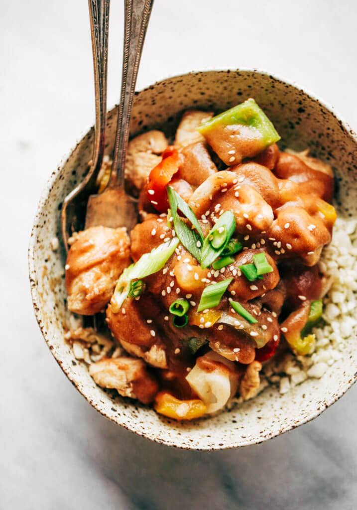 Healthy sweet and sour chicken with cauliflower rice. Paleo, whole30, and made without sugar! An easy weeknight dinner recipe, freezer friendly, and makes for fast meal prep! Whole30 meal plan that's quick and healthy! Whole30 recipes just for you. Whole30 meal planning. Whole30 meal prep. Healthy paleo meals. Healthy Whole30 recipes. Easy Whole30 recipes. Best paleo dinner recipes.