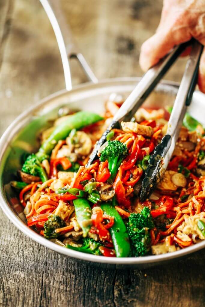 Healthy Lo Mein made with delicious carrot noodles! An Easy 15 minute whole30 meal the whole family will enjoy! Grain free, paleo, and gluten free. The servings are big. The food is tasty! I did not want to stop eating this! I wanted to eat all four servings by myself. A big ol’ serving of these lo mein noodles carries all of the delicousness factor with only 343 calories!  Whole30 meal plan that's quick and healthy! Whole30 recipes just for you. Whole30 meal planning. Whole30 meal prep. Healthy paleo meals. Healthy Whole30 recipes. Easy Whole30 recipes. Best paleo dinner recipes.