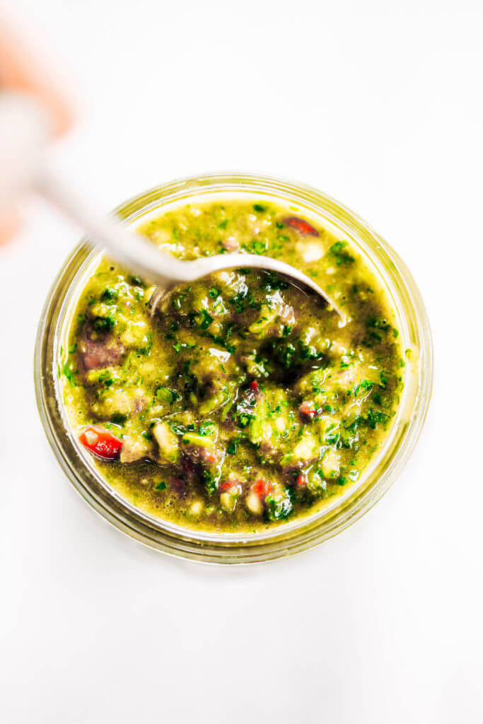 Zesty, fresh, and flavorful, cilantro garlic chimichurri with jalapeno pepper. Perfect for marinating chicken, beef, or topping off sweet potato fries and salads! Made easy in the blender in five minutes. Paleo, gluten free, and whole30 friendly. Easy whole30 dinner recipes. Whole30 recipes. Whole30 lunch. Whole30 recipes just for you. Whole30 meal planning. Whole30 meal prep. Healthy paleo meals. Healthy Whole30 recipes. Easy Whole30 recipes