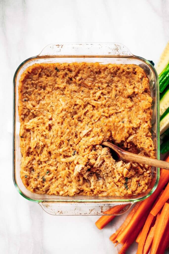 Creamy dairy free buffalo chicken and cauliflower rice bake. Perfect for dipping veggies, chips, or loading on a baked potato! This “cheesy” creamy dip makes the perfect lunch when paired with a handful of carrot sticks! Paleo, whole30, and gluten free.Whole30 meal plan that's quick and healthy! Whole30 recipes just for you. Whole30 meal planning. Whole30 meal prep. Healthy paleo meals. Healthy Whole30 recipes. Easy Whole30 recipes. Best paleo dinner recipes.