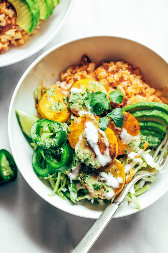 Spicy buffalo cauliflower rice plantain slaw bowls made with crispy french fry-like fried plantains, spicy buffalo cauliflower rice, and cilantro lime slaw. A fresh, zesty meal that's whole30 and paleo friendly. whole30 meal plan. Easy whole30 dinner recipes. Easy whole30 dinner recipes. Whole30 recipes. Whole30 lunch. Whole30 meal planning. Whole30 meal prep. Healthy paleo meals. Healthy Whole30 recipes. Easy Whole30 recipes. Easy whole30 dinner recipes.