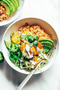 Spicy buffalo cauliflower rice plantain slaw bowls made with crispy french fry-like fried plantains, spicy buffalo cauliflower rice, and cilantro lime slaw. A fresh, zesty meal that's whole30 and paleo friendly. whole30 meal plan. Easy whole30 dinner recipes. Easy whole30 dinner recipes. Whole30 recipes. Whole30 lunch. Whole30 meal planning. Whole30 meal prep. Healthy paleo meals. Healthy Whole30 recipes. Easy Whole30 recipes. Easy whole30 dinner recipes.