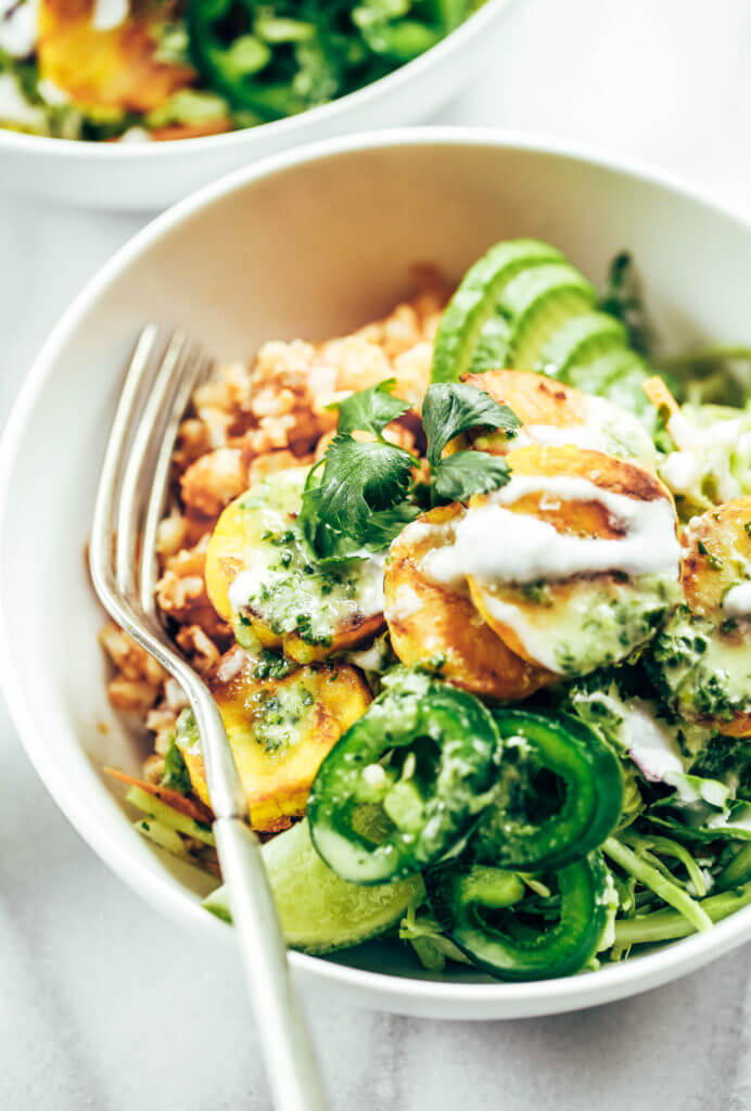 Spicy buffalo cauliflower rice plantain slaw bowls made with crispy french fry-like fried plantains, spicy buffalo cauliflower rice, and cilantro lime slaw. A fresh, zesty meal that's whole30 and paleo friendly. whole30 meal plan. Easy whole30 dinner recipes. Easy whole30 dinner recipes. Whole30 recipes. Whole30 lunch. Whole30 meal planning. Whole30 meal prep. Healthy paleo meals. Healthy Whole30 recipes. Easy Whole30 recipes. Easy whole30 dinner recipes.