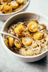 Warm and toasty Paleo banana cereal. Made with caramelized bananas, chia seeds, golden flax, hemp, and coconut. This grain free cereal tastes like oatmeal and is topped with my favorite caramelized bananas! Paleo, gluten free, healthy. Whole30 breakfast recipe. Easy paleo breakfast ideas. Whole30 breakfast ideas. paleo cereal recipe. whole30 meal plan.h. Whole30 meal planning. Whole30 meal prep. Healthy paleo meals. Healthy Whole30 recipes. Easy Whole30 recipes.