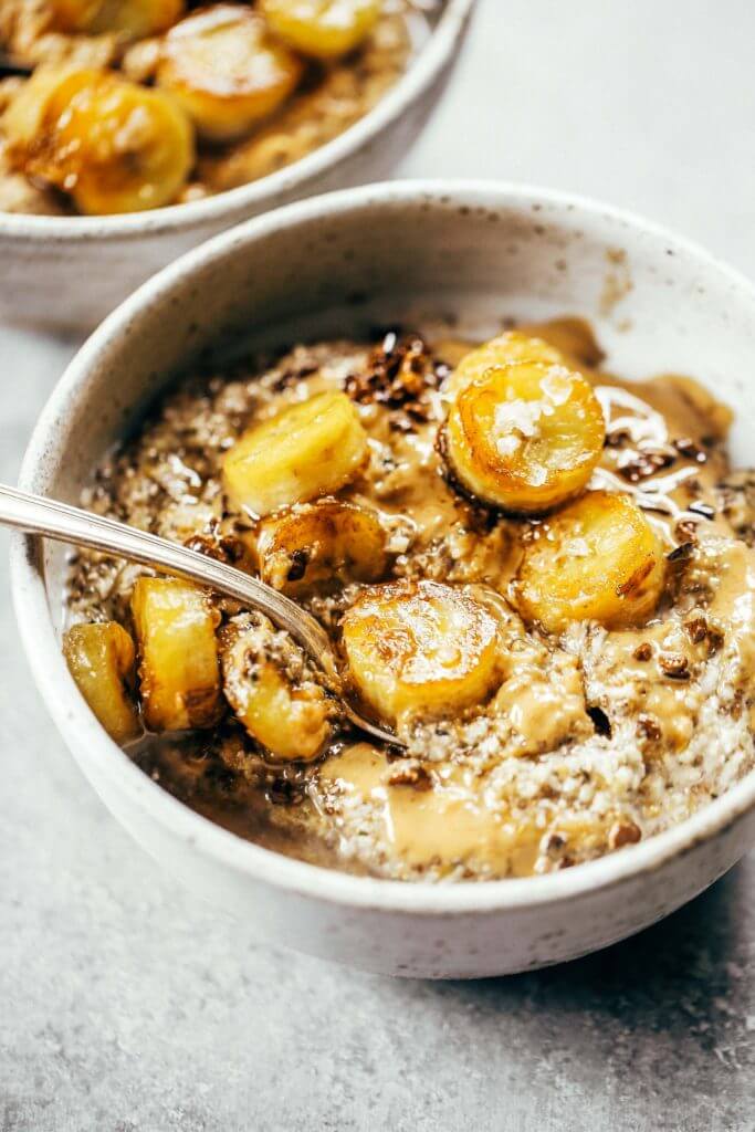 Warm and toasty Paleo banana cereal. Made with caramelized bananas, chia seeds, golden flax, hemp, and coconut. This grain free cereal tastes like oatmeal and is topped with my favorite caramelized bananas! Paleo, gluten free, healthy. Whole30 breakfast recipe. Easy paleo breakfast ideas. Whole30 breakfast ideas. paleo cereal recipe. whole30 meal plan.h. Whole30 meal planning. Whole30 meal prep. Healthy paleo meals. Healthy Whole30 recipes. Easy Whole30 recipes.