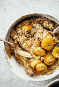 Warm and toasty Paleo banana cereal. Made with caramelized bananas, chia seeds, golden flax, hemp, and coconut. This grain free cereal tastes like oatmeal and is topped with my favorite caramelized bananas! Paleo, gluten free, healthy. Whole30 breakfast recipe. Easy paleo breakfast ideas. Whole30 breakfast ideas. paleo cereal recipe. whole30 meal plan.h. Whole30 meal planning. Whole30 meal prep. Healthy paleo meals. Healthy Whole30 recipes. Easy Whole30 recipes.