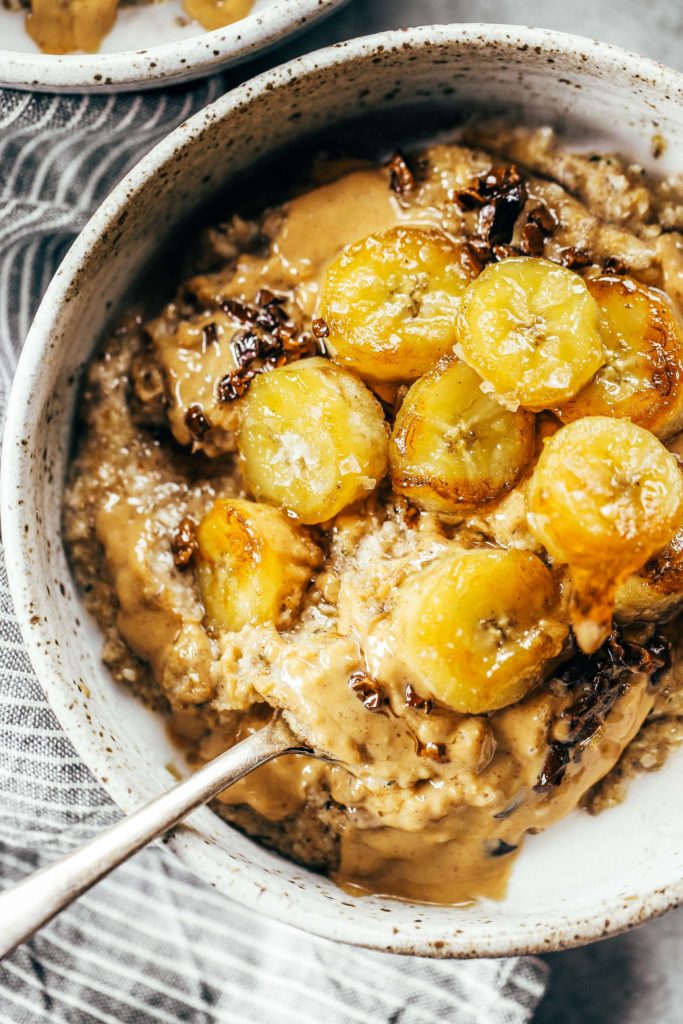Warm and toasty Paleo banana cereal. Made with caramelized bananas, chia seeds, golden flax, hemp, and coconut. This grain free cereal tastes like oatmeal and is topped with my favorite caramelized bananas! Paleo, gluten free, healthy. Whole30 breakfast recipe. Easy paleo breakfast ideas. Whole30 breakfast ideas. paleo cereal recipe. whole30 meal plan.h. Whole30 meal planning. Whole30 meal prep. Healthy paleo meals. Healthy Whole30 recipes. Easy Whole30 recipes.