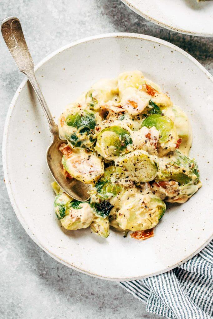 Creamy bacon brussel sprouts in cauliflower cream sauce! This dish is outstanding all on it’s own or can be paired with another side of greens. It’s a family favorite! Gluten free, dairy free, paleo, and whole30. Easy whole30 dinner recipes. Whole30 recipes. Whole30 lunch. Whole30 recipes just for you. Whole30 meal planning. Whole30 meal prep. Healthy paleo meals. Healthy Whole30 recipes. Easy Whole30 recipes.