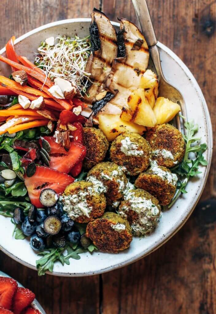 Baked falafel made with sweet potato and cauliflower in a food processor! Healthy whole30 vegan falafel recipe with minty herb sauce and a summer salad! This easy paleo falafel can be made ahead and frozen. Vegan falafel recipe. Easy falafel bowl. Healthy baked falafel. Authentic falafel recipe. Best paleo falafel. Easy whole30 lunch ideas. Easy paleo dinner recipes. Easy whole30 dinner recipes. Whole30 recipes. Whole30 lunch. Whole30 meal planning. Whole30 meal prep. Healthy paleo meals. Healthy Whole30 recipes. Easy Whole30 recipes.