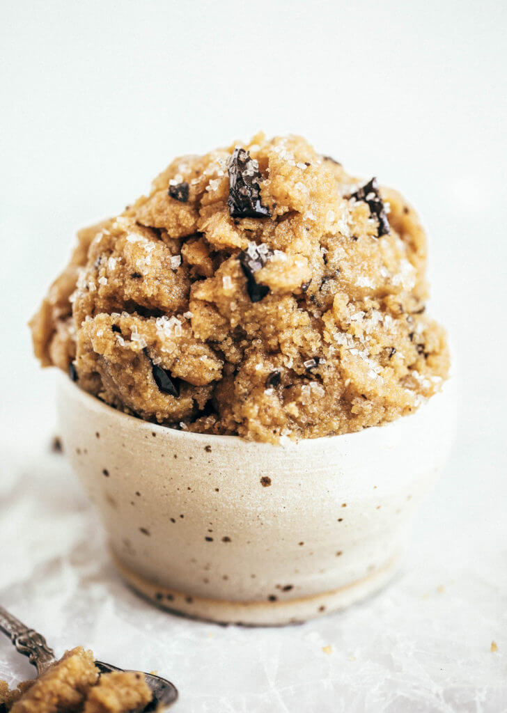 Healthy paleo cookie dough that's safe to eat raw! This cookie dough is gluten free, dairy free, and made without refined sugars. Ready in just five minutes! Paleo cookies no egg. Easy paleo cookie recipes. No bake paleo cookies. Healthy paleo cookies. Easy paleo snacks for on the go. Almond paleo cookies. best paleo cookie dough.