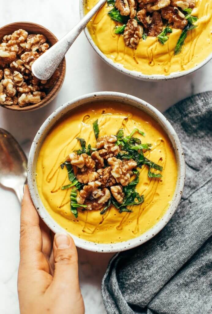 Creamy golden turmeric vegetable soup; made with vegetables, cashews, and curry spices! A warm and comforting paleo whole30 dinner recipe, full of rich earthy flavors. Whole30 easy recipes. Easy whole30 dinners. Whole30 trader joes recipes. Whole30 dinner meal planning. Easy whole30 soup. Paleo for beginners. Paleo diet recipes. Paleo dinner ideas.