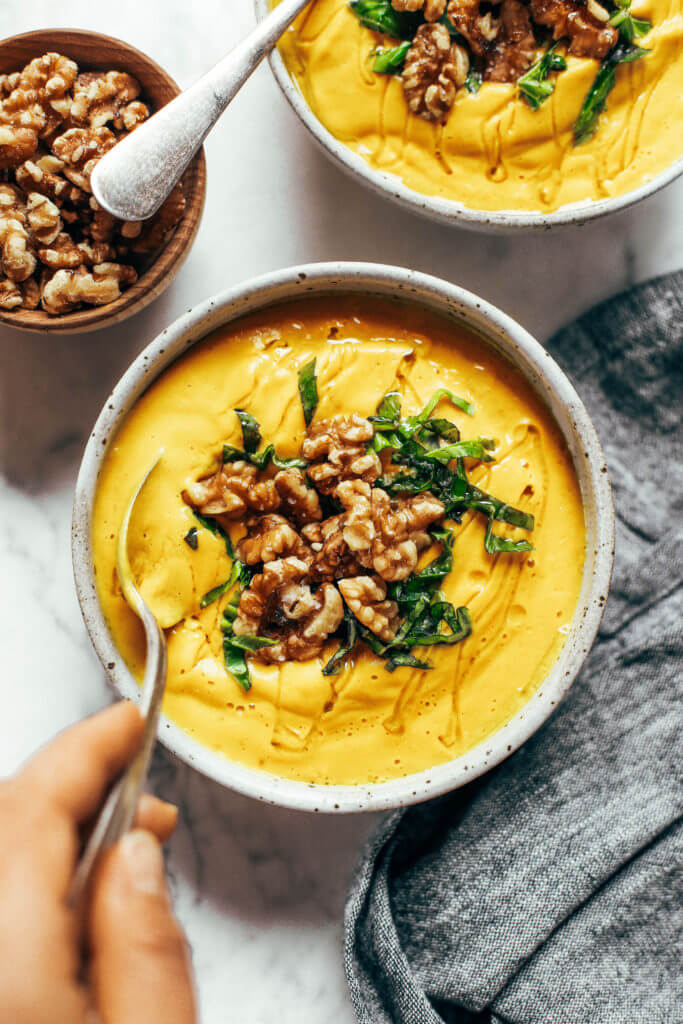 Creamy golden turmeric vegetable soup; made with vegetables, cashews, and curry spices! A warm and comforting paleo whole30 dinner recipe, full of rich earthy flavors. Whole30 easy recipes. Easy whole30 dinners. Whole30 trader joes recipes. Whole30 dinner meal planning. Easy whole30 soup. Paleo for beginners. Paleo diet recipes. Paleo dinner ideas.