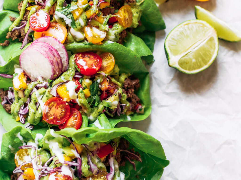 Crowd pleaser dinner: whole30 lettuce tacos with mango salsa! Swap the tortilla for a healthy crisp lettuce leaf and you have yourself a drool-worthy dinner, complete with mango avocado lime salsa. An easy paleo meal for family dinners, meal prep, or on-the-go! Easy whole30 recipes. Easy whole30 trader joes dinner. Easy whole30 dinner meal planning. Easy paleo tacos.