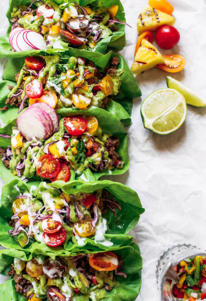 Crowd pleaser dinner: whole30 lettuce tacos with mango salsa! Swap the tortilla for a healthy crisp lettuce leaf and you have yourself a drool-worthy dinner, complete with mango avocado lime salsa. An easy paleo meal for family dinners, meal prep, or on-the-go! Easy whole30 recipes. Easy whole30 trader joes dinner. Easy whole30 dinner meal planning. Easy paleo tacos.