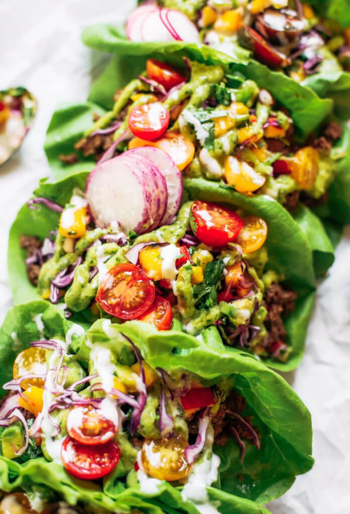 Crowd pleaser dinner: whole30 lettuce tacos with mango salsa! Swap the tortilla for a healthy crisp lettuce leaf and you have yourself a drool-worthy dinner, complete with mango avocado lime salsa. An easy paleo meal for family dinners, meal prep, or on-the-go! Easy whole30 recipes. Easy whole30 trader joes dinner. Easy whole30 dinner meal planning. Easy paleo tacos.