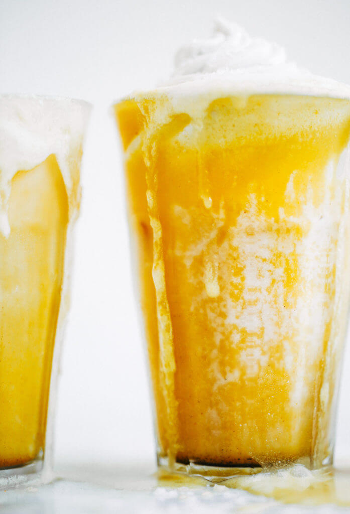 Top on my paleo food list: golden iced turmeric lattes. Tastes like liquid sunshine! An easy refreshing paleo and whole30 beverage, perfect for summer. #paleo #summer #golden Paleo for beginners. Paleo diet recipes. Paleo breakfast on the go. Easy paleo snacks. Best golden milk latte. Whole30 breakfast recipes. Whole30 rules. Whole30 snacks.