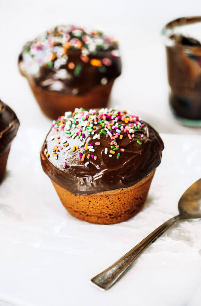 Fluffy paleo chocolate cupcakes made in the blender in 5 minutes! These chocolate cupcakes are made with healthy ingredients, avocado buttercream, and natural sprinkles! #paleo #chocolate #cupcakes #healthydessert #glutenfree #cake Paleo chocolate cupcakes recipes. Chocolate cupcakes from scratch.