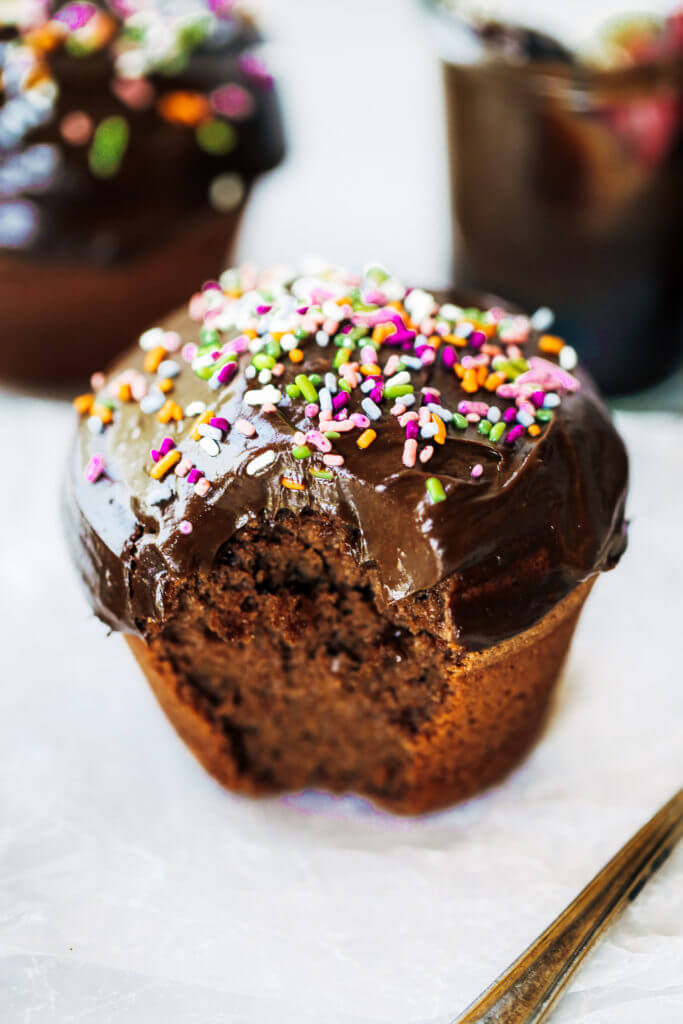 Fluffy paleo chocolate cupcakes made in the blender in 5 minutes! These chocolate cupcakes are made with healthy ingredients, avocado buttercream, and natural sprinkles! #paleo #chocolate #cupcakes #healthydessert #glutenfree #cake Paleo chocolate cupcakes recipes. Chocolate cupcakes from scratch.