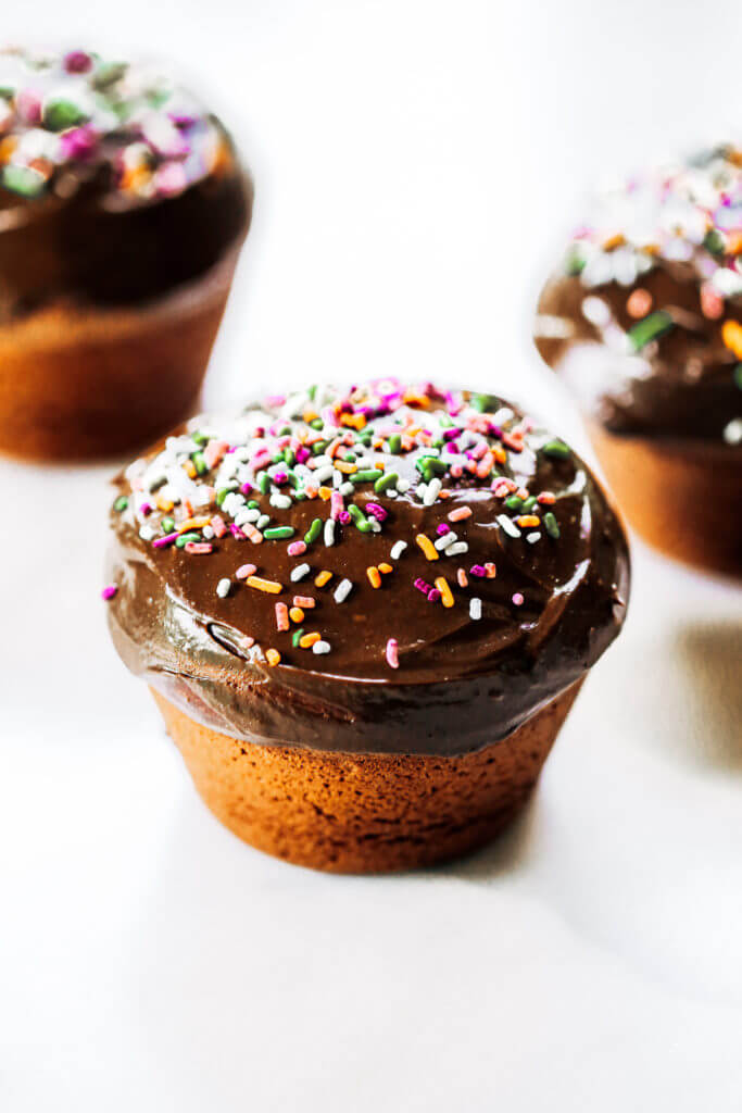 Fluffy paleo chocolate cupcakes made in the blender in 5 minutes! These chocolate cupcakes are made with healthy ingredients, avocado buttercream, and natural sprinkles! #paleo #chocolate #cupcakes #healthydessert #glutenfree #cake Paleo chocolate cupcakes recipes. Chocolate cupcakes from scratch.