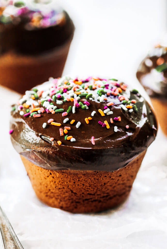 Fluffy paleo chocolate cupcakes made in the blender in 5 minutes! These chocolate cupcakes are made with healthy ingredients, avocado buttercream, and natural sprinkles! #paleo #chocolate #cupcakes #healthydessert #glutenfree #cake Paleo chocolate cupcakes recipes. Chocolate cupcakes from scratch.