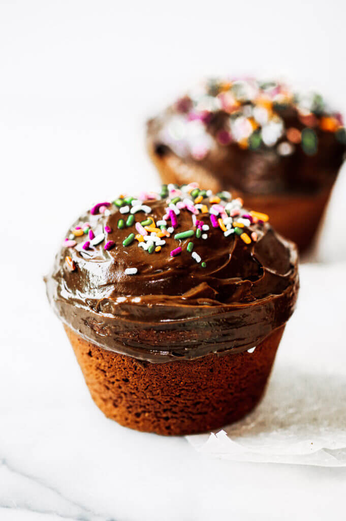 Fluffy paleo chocolate cupcakes made in the blender in 5 minutes! These chocolate cupcakes are made with healthy ingredients, avocado buttercream, and natural sprinkles! #paleo #chocolate #cupcakes #healthydessert #glutenfree #cake Paleo chocolate cupcakes recipes. Chocolate cupcakes from scratch.