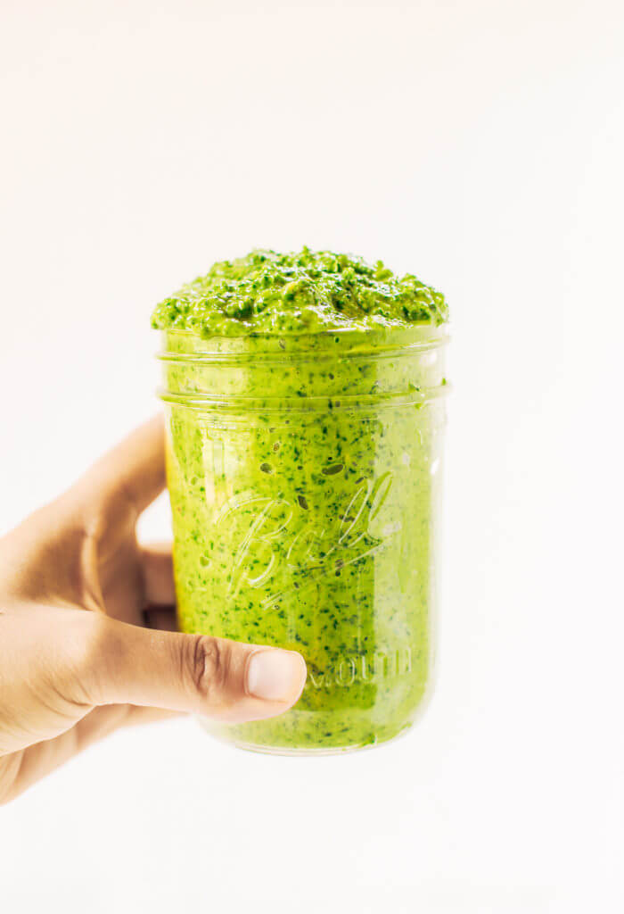 5 minute vegan kale pesto made with avocado, olive oil, and garlic. An easy paleo whole30 sauce to serve with pasta, veggie sticks, or eat with a spoon! A healthy, light, and fresh sauce. Easy whole30 pesto. paleo pesto recipe. Dairy free pesto. Best dairy free pesto recipe. Best whole30 pesto recipe.