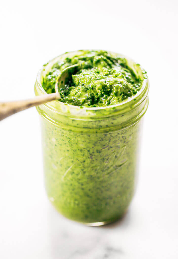 5 minute vegan kale pesto made with avocado, olive oil, and garlic. An easy paleo whole30 sauce to serve with pasta, veggie sticks, or eat with a spoon! A healthy, light, and fresh sauce. Easy whole30 pesto. paleo pesto recipe. Dairy free pesto. Best dairy free pesto recipe. Best whole30 pesto recipe.