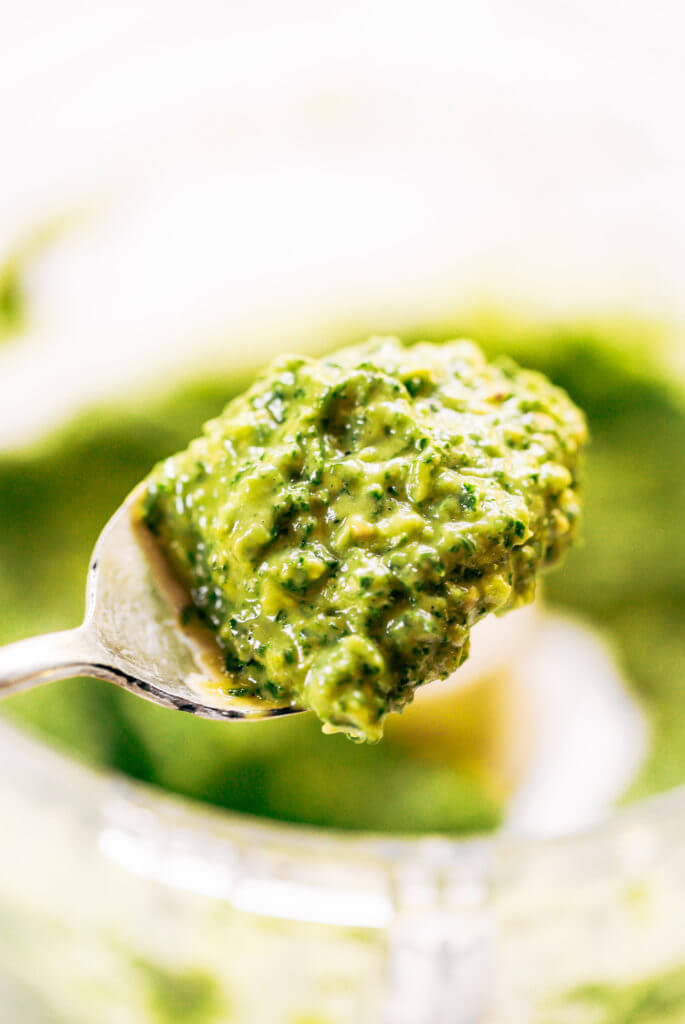 5 minute vegan kale pesto made with avocado, olive oil, and garlic. An easy paleo whole30 sauce to serve with pasta, veggie sticks, or eat with a spoon! A healthy, light, and fresh sauce. Easy whole30 pesto. paleo pesto recipe. Dairy free pesto. Best dairy free pesto recipe. Best whole30 pesto recipe.