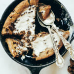 Paleo cookie skillet made in 5 minutes in the food processor. Gluten free chocolate chip cookie with a gooey inside and nice crust. Easy to make paleo dessert to share with friends! #paleo #cookie #healthydessert Easy paleo cookie recipes. Healthy paleo cookies. Easy gluten free cookie recipes. Best paleo cookie recipes. Best easy gluten free cookies.