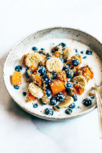 Easiest low calorie healthy breakfast! Sweet potato fruit cereal is made with baked sweet potato, fresh fruit, and nut milk of choice. This is a perfect paleo whole30 breakfast for on the go. #paleo #whole30 #mealprep #healthybreakfast