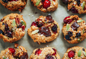 Perfect paleo kitchen sink cookies made with almond flour. Low sugar cookies that make holiday baking easy and delicious! Load them up with cranberries, chocolate, pecans, and seeds! My favorite paleo gluten free cookie recipe- it also happens to be an egg free cookie! #cookies #baking #paleo #almondflour #glutenfree #dessert