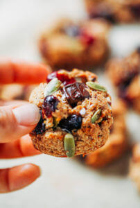 Perfect paleo kitchen sink cookies made with almond flour. Low sugar cookies that make holiday baking easy and delicious! Load them up with cranberries, chocolate, pecans, and seeds! My favorite paleo gluten free cookie recipe- it also happens to be an egg free cookie! #cookies #baking #paleo #almondflour #glutenfree #dessert