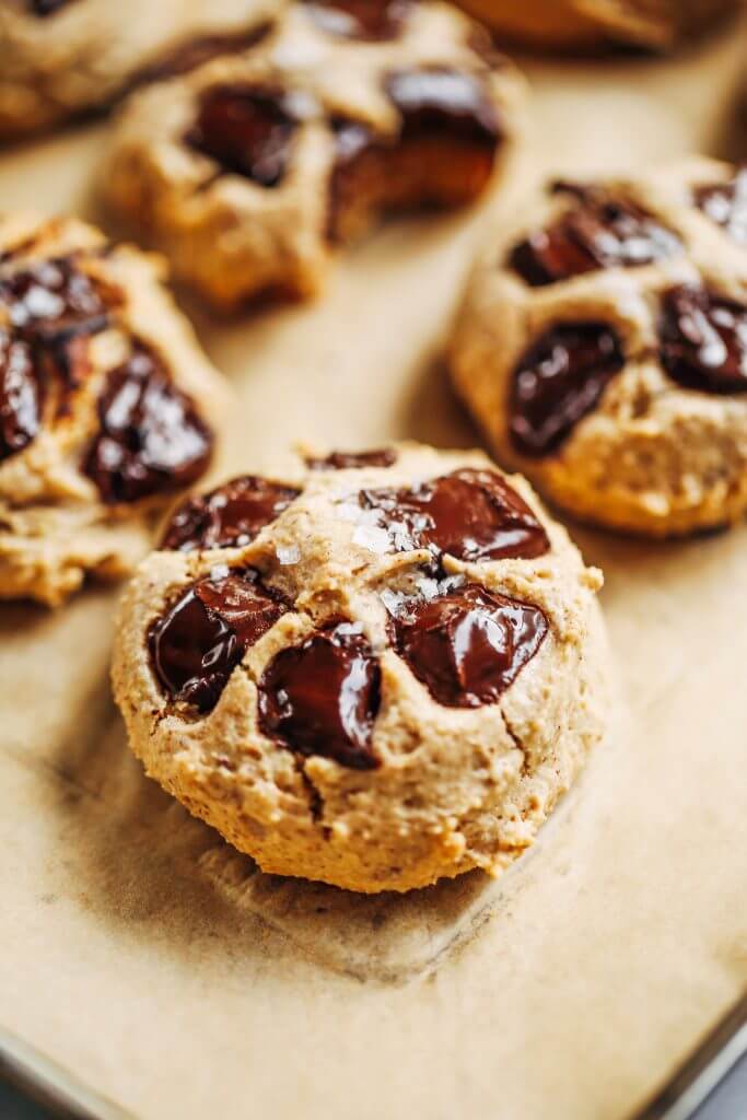 Low sugar cookies made with only 3 tablespoons maple syrup! Healthier almond flour chocolate chip cookies. Easy paleo cookies made with almond flour, the whole family will love! #cookies #paleo #baking #glutenfree