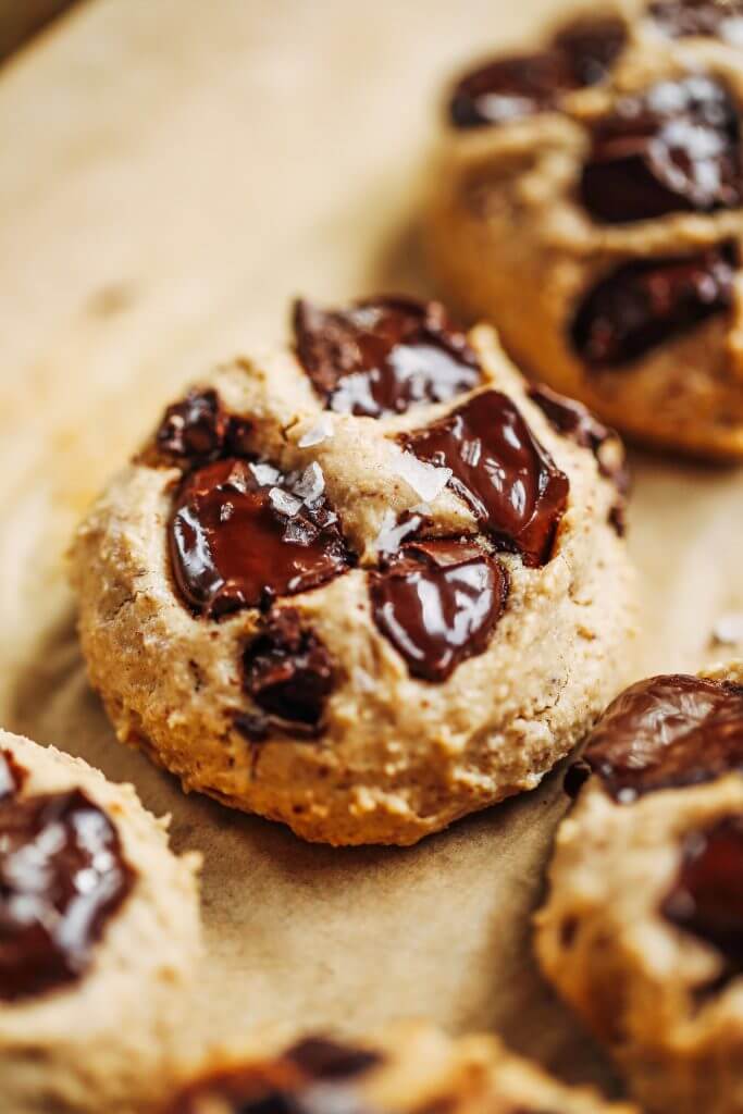 Low sugar cookies made with only 3 tablespoons maple syrup! Healthier almond flour chocolate chip cookies. Easy paleo cookies made with almond flour, the whole family will love! #cookies #paleo #baking #glutenfree