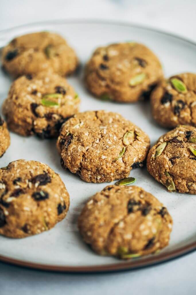 Homemade paleo cookies that taste like oatmeal raisin cookies, but made without any oats! Easy gluten free cookies made with almond flour. These cookies make a perfect low sugar breakfast cookie or dessert. #cookies #almondflour #paleo #lowsugar