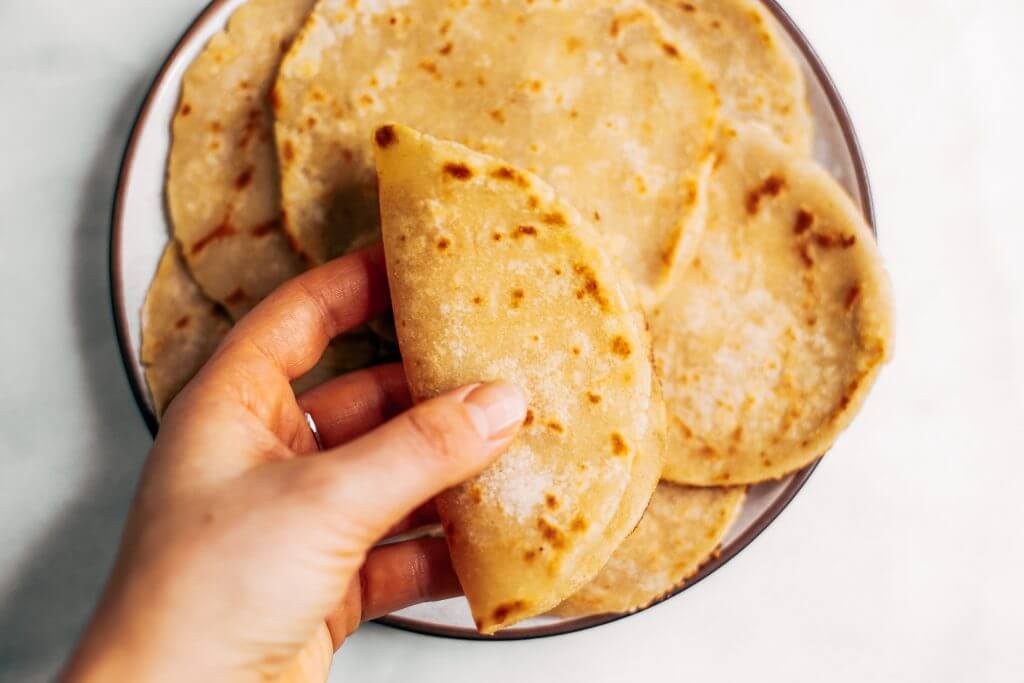 Two ingredient paleo cauliflower tortillas! Life-changing recipe for low calorie gluten free tortillas, ready in minutes! These tortillas have 42 calories and are loaded with veggies to keep you healthy and satisfied. Delicious, easy, and mind-blowing-easy recipe for homemade tortillas. #paleo #recipes #cooking #healthy