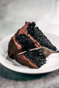 Best paleo chocolate cake you will ever have! Made with sweet potatoes instead of flour and avocado chocolate frosting. This flourless and dairy free chocolate cake is made in the food processor and perfect for any celebration! Are you ready for this easy gluten free chocolate cake recipe? #cake #recipes #baking #paleo