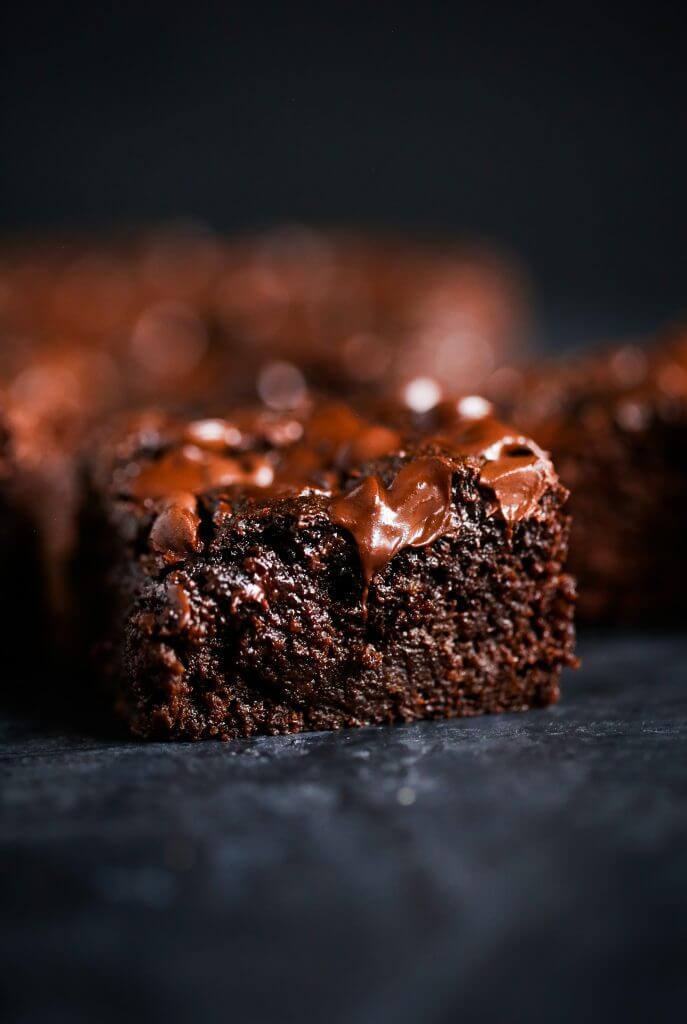 Easy homemade brownies with a fudgey middle and crispy delicious corners. These gluten free brownies are family favorites- filled with rich chocolate flavor and made with healthy ingredients! Best flourless brownies made with sweet potato instead of flour! #baking #brownies #dessert #glutenfree