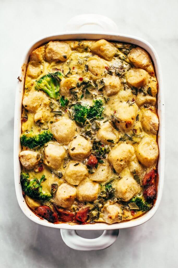 Baked cauliflower gnocchi casserole- made with homemade two ingredient cauliflower gnocchi and rosemary sage cream sauce. Paleo, gluten free, and dairy free family dinner. This casserole is perfect for breakfast or dinner! Easy whole30 dinner recipes. Whole30 meal prep. Best paleo dinners. #paleo