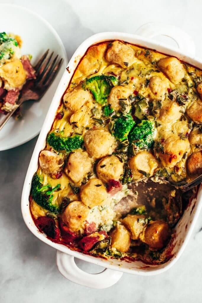 Baked cauliflower gnocchi casserole- made with homemade two ingredient cauliflower gnocchi and rosemary sage cream sauce. Paleo, gluten free, and dairy free family dinner. This casserole is perfect for breakfast or dinner! Easy whole30 dinner recipes. Whole30 meal prep. Best paleo dinners. #paleo