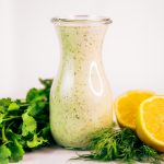 Creamy lemon garlic dressing is both whole30 and paleo. This easy dairy free salad dressing tastes like ranch dressing and is made with coconut milk! A healthy oil-free paleo dressing recipe. #paleo #whole30 #cooking #recipes