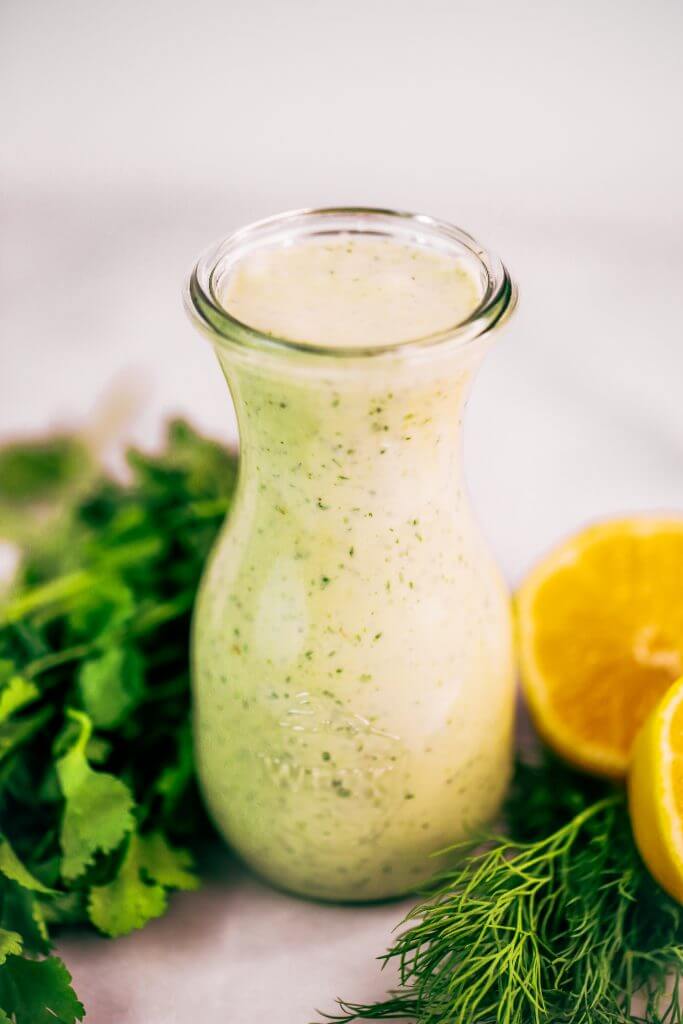 Creamy lemon garlic dressing is both whole30 and paleo. This easy dairy free salad dressing tastes like ranch dressing and is made with coconut milk! A healthy oil-free paleo dressing recipe. #paleo #whole30 #cooking #recipes
