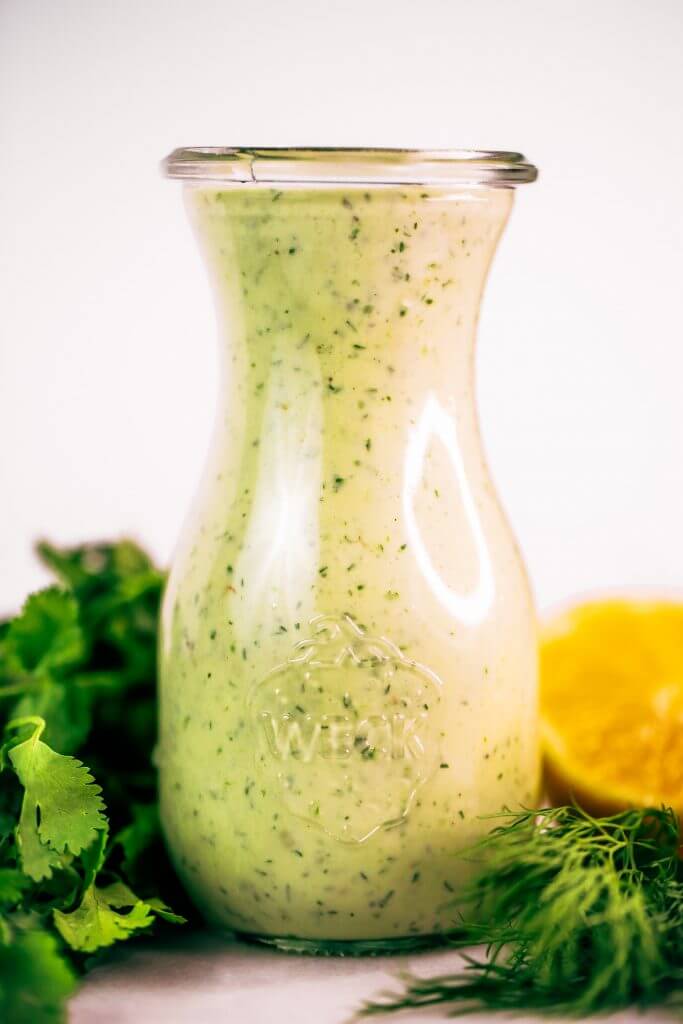 Creamy lemon garlic dressing is both whole30 and paleo. This easy dairy free salad dressing tastes like ranch dressing and is made with coconut milk! A healthy oil-free paleo dressing recipe. #paleo #whole30 #cooking #recipes