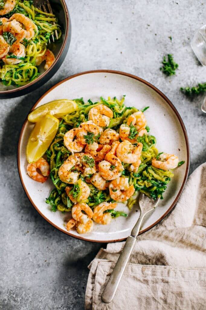 Whole30 zucchini noodles with lemon garlic shrimp. An easy and delicious weeknight dinner. Who’s ready for this healthy low calorie and filling paleo dinner? #paleo #whole30 #healthydinner