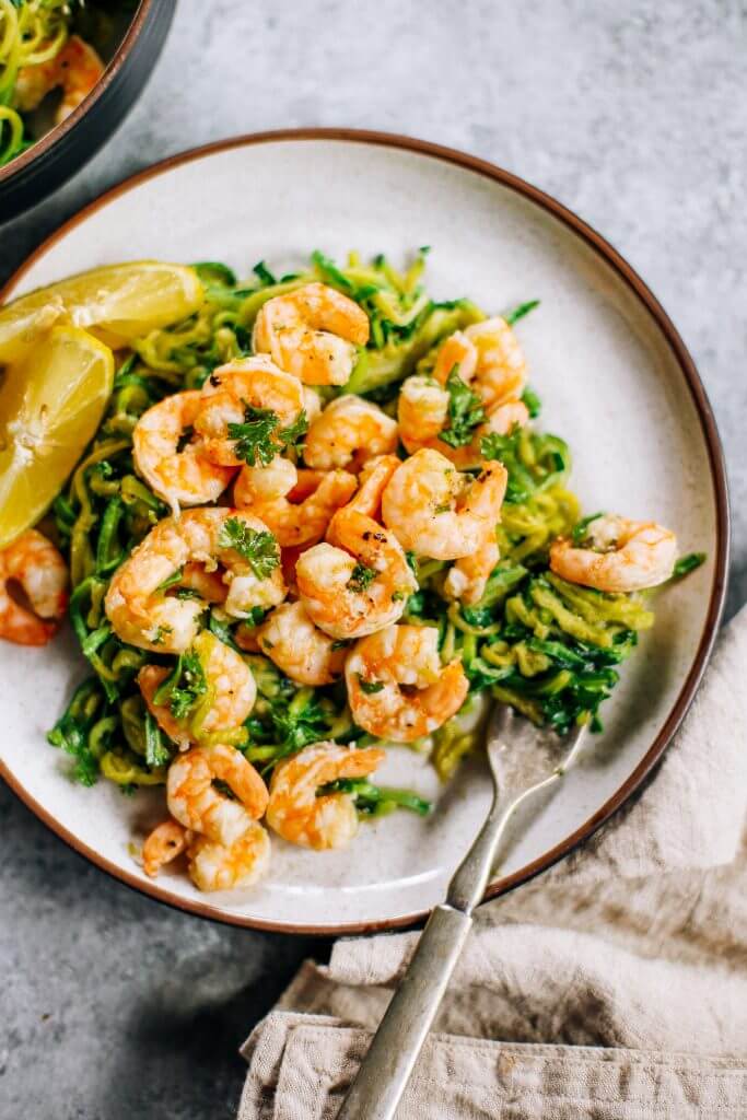 Whole30 zucchini noodles with lemon garlic shrimp. An easy and delicious weeknight dinner. Who’s ready for this healthy low calorie and filling paleo dinner? #paleo #whole30 #healthydinner