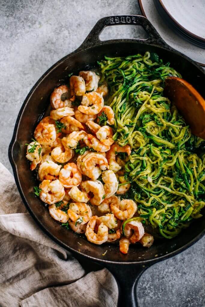 Whole30 zucchini noodles with lemon garlic shrimp. An easy and delicious weeknight dinner. Who’s ready for this healthy low calorie and filling paleo dinner? #paleo #whole30 #healthydinner