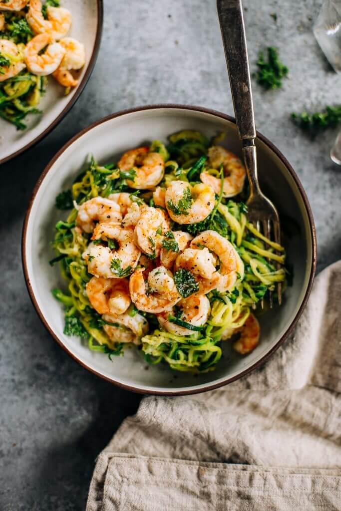 Whole30 zucchini noodles with lemon garlic shrimp. An easy and delicious weeknight dinner. Who’s ready for this healthy low calorie and filling paleo dinner? #paleo #whole30 #healthydinner